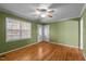 Inviting living room features hardwood floors, a ceiling fan and a front door at 41 Rock Bluff Ln, Kittrell, NC 27544