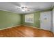 Inviting living room features hardwood floors, a ceiling fan and a front door at 41 Rock Bluff Ln, Kittrell, NC 27544
