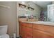 A well-lit bathroom features a vanity with lots of storage and a shower with new doors at 4105 Lassiter Rd, Wake Forest, NC 27587