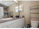 Bathroom featuring a vanity, toilet, and a large mirror at 4105 Lassiter Rd, Wake Forest, NC 27587