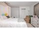 Bright bedroom featuring a comfortable bed and dresser, complemented by a neutral color scheme and soft natural light at 4105 Lassiter Rd, Wake Forest, NC 27587