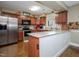 Well-lit kitchen with stainless steel appliances and breakfast bar with butcher block countertops at 4105 Lassiter Rd, Wake Forest, NC 27587