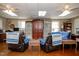 Inviting living room with plush seating, ceiling fans, and rustic decor elements at 4105 Lassiter Rd, Wake Forest, NC 27587