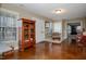 Secondary living room space with display cabinet and view of front entrance at 4105 Lassiter Rd, Wake Forest, NC 27587