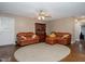 Living room features leather sofas, decorative cabinet, and neutral area rug at 4105 Lassiter Rd, Wake Forest, NC 27587