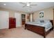 Comfortable bedroom featuring carpet, a ceiling fan, and a walk-in closet for ample storage at 4105 Lassiter Rd, Wake Forest, NC 27587