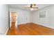 Neutral bedroom featuring hardwood floors and ample natural light at 413 S Maple St, Graham, NC 27253