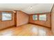 Empty bedroom with hardwood floors, light-colored walls, and natural light at 413 S Maple St, Graham, NC 27253