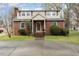 Charming brick home featuring a classic design, well-maintained lawn, and inviting curb appeal at 413 S Maple St, Graham, NC 27253