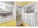 Cozy sunroom with natural light offering peaceful views at 413 S Maple St, Graham, NC 27253