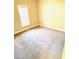 Bright bedroom with neutral carpeting and a window that provides natural light at 45 Crabtree Ct, Fuquay Varina, NC 27526