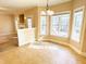Bright dining area with multiple windows and neutral colors, flowing into living spaces at 45 Crabtree Ct, Fuquay Varina, NC 27526