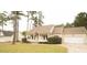 Charming ranch home features a welcoming front porch, attached garage, and beautifully landscaped yard at 45 Crabtree Ct, Fuquay Varina, NC 27526