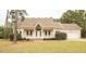 Inviting ranch home with a covered porch, attached garage, and well-maintained lawn at 45 Crabtree Ct, Fuquay Varina, NC 27526