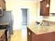 Functional kitchen with brown cabinets, stainless appliances, and plenty of counter space at 45 Crabtree Ct, Fuquay Varina, NC 27526