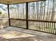 Spacious screened porch offering a relaxing view of the surrounding trees and natural light at 45 Crabtree Ct, Fuquay Varina, NC 27526