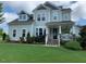 Charming two-story home with a well-manicured lawn and inviting front porch at 465 Claremont Dr, Chapel Hill, NC 27516