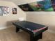 An upstairs bonus room area is shown, featuring an air hockey table and sloped ceilings at 465 Claremont Dr, Chapel Hill, NC 27516
