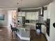 Spacious kitchen with stainless steel appliances, granite countertops, and a large island at 465 Claremont Dr, Chapel Hill, NC 27516