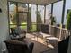 Relaxing screened-in porch with comfortable seating at 465 Claremont Dr, Chapel Hill, NC 27516