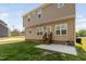 The backyard features a patio and a grassy area for outdoor enjoyment at 50 Yelverton Ct, Holly Springs, NC 27540