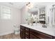 This bathroom features double sinks, modern fixtures, and plenty of storage space at 50 Yelverton Ct, Holly Springs, NC 27540