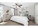 Comfortable bedroom with a ceiling fan, neutral walls, and stylish decor at 50 Yelverton Ct, Holly Springs, NC 27540
