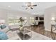Bright, open floor plan with hardwood floors, living room, dining area, and modern kitchen at 50 Yelverton Ct, Holly Springs, NC 27540