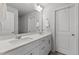 Bathroom with a double vanity, tile floors, and a large mirror at 5200 Invention Way, Raleigh, NC 27616