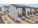 Exterior view of modern townhomes with two car garages at 5200 Invention Way, Raleigh, NC 27616