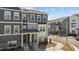 Inviting gray townhome with a stone foundation and an inviting entryway at 5200 Invention Way, Raleigh, NC 27616