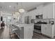Modern kitchen featuring white cabinets, stainless steel appliances, and island with bar seating at 5200 Invention Way, Raleigh, NC 27616