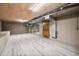 Unfinished basement area with concrete flooring, exposed ceiling, and natural light at 5313 Edington Ln, Raleigh, NC 27604