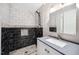Modern bathroom with tiled walk-in shower, granite countertop and sleek vanity at 5313 Edington Ln, Raleigh, NC 27604