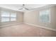 Spacious bedroom featuring neutral walls, carpet flooring and two windows for natural light at 5313 Edington Ln, Raleigh, NC 27604