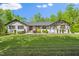 Ranch-style home with well-manicured lawn and landscaping, enhancing its curb appeal at 5313 Edington Ln, Raleigh, NC 27604
