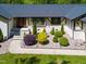 Well-maintained front yard features colorful landscaping and a charming home exterior with a new roof at 5313 Edington Ln, Raleigh, NC 27604