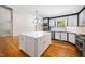 Bright kitchen features an island and stainless steel appliances at 5313 Edington Ln, Raleigh, NC 27604