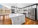 Modern kitchen features a large island, stainless steel appliances, and ample storage at 5313 Edington Ln, Raleigh, NC 27604
