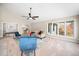 Bright living room features vaulted ceiling, ceiling fan, and large windows with natural light at 5313 Edington Ln, Raleigh, NC 27604