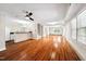 Large living area with hardwood floors seamlessly connecting to the open kitchen space at 5313 Edington Ln, Raleigh, NC 27604