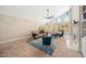 Bright living room with large windows, vaulted ceilings, a ceiling fan, and carpeted floors at 5313 Edington Ln, Raleigh, NC 27604
