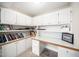 Bright office with built-in shelves, cabinets, and drawers at 5313 Edington Ln, Raleigh, NC 27604