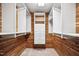 Spacious walk-in closet featuring custom wood paneling and shelving for optimal storage at 5313 Edington Ln, Raleigh, NC 27604