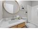 This bathroom boasts a stylish mirror, vanity, and tub/shower combination at 5340 Big Bass Dr, Raleigh, NC 27610