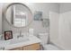 Bright bathroom with a stylish mirror, vanity, and tub/shower combination at 5340 Big Bass Dr, Raleigh, NC 27610
