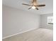 Well-lit bedroom with a ceiling fan and window showcasing the neighborhood views at 5340 Big Bass Dr, Raleigh, NC 27610