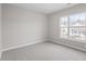 Bright bedroom with a large window providing natural light and outdoor views at 5340 Big Bass Dr, Raleigh, NC 27610