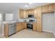 Well-equipped kitchen with stainless steel appliances and sleek granite countertops and backsplash at 5340 Big Bass Dr, Raleigh, NC 27610