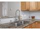 Granite counters and a modern faucet add a touch of elegance to this kitchen sink at 5340 Big Bass Dr, Raleigh, NC 27610